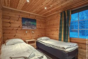 Feriendorf Harriniva - Blockhütte am Fluss, Schlafzimmer