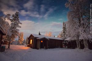 Schneemobil Safari Schweden - Hütten Nordlicht